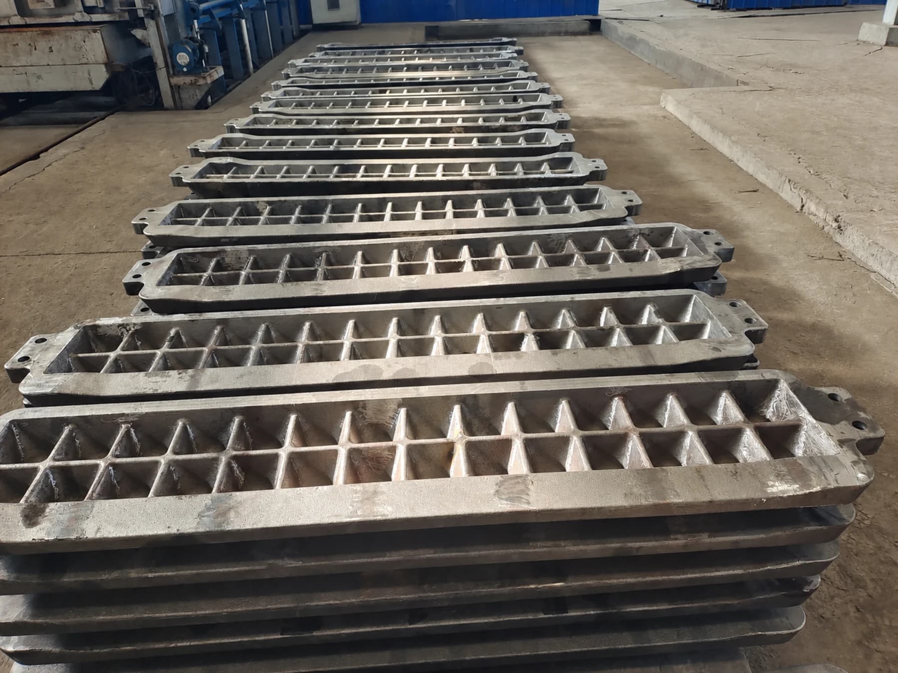 Rows of QB-22 ductile iron ingot moulds