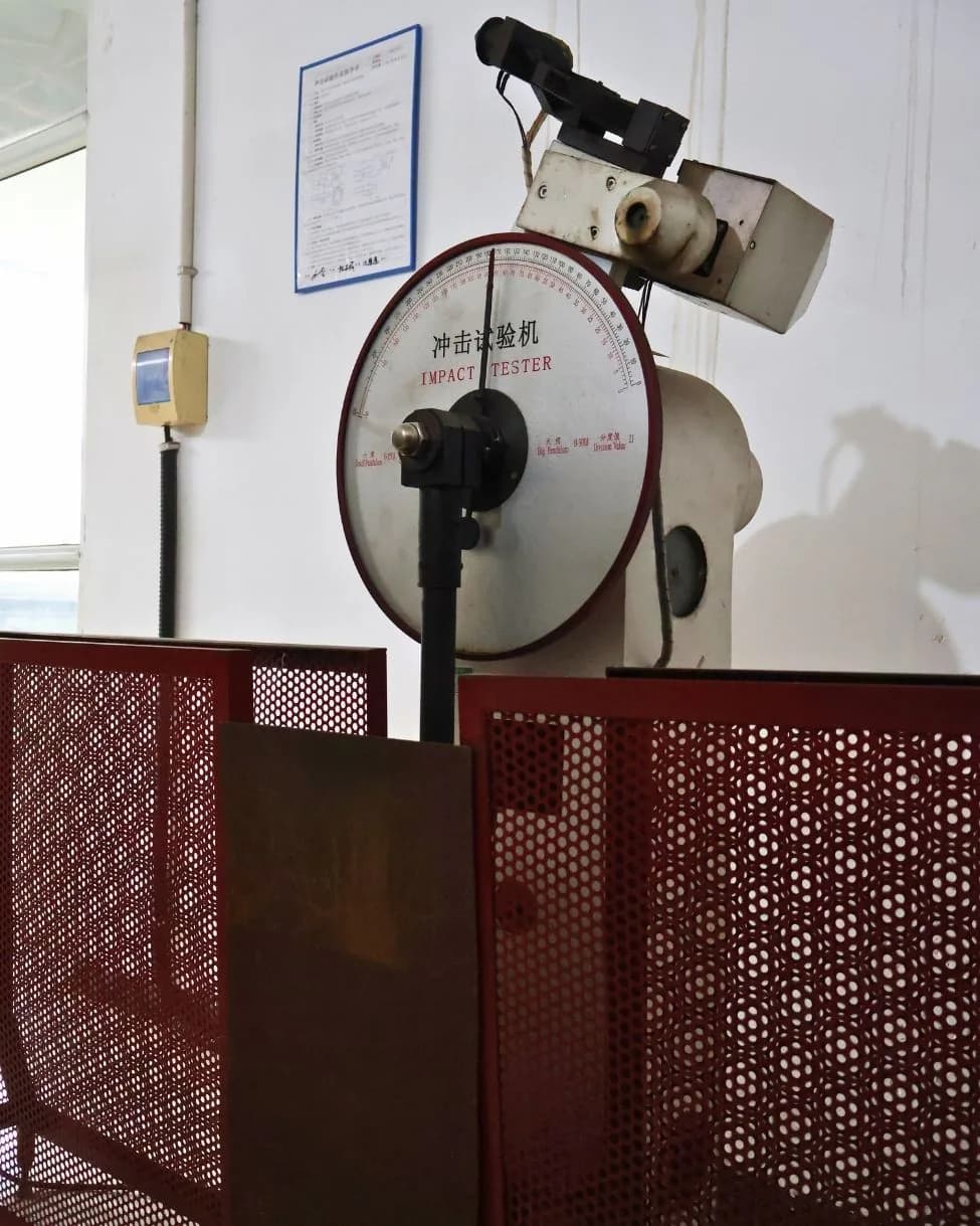 Impact testing machine for Charpy V-notch toughness verification of cast steel components.